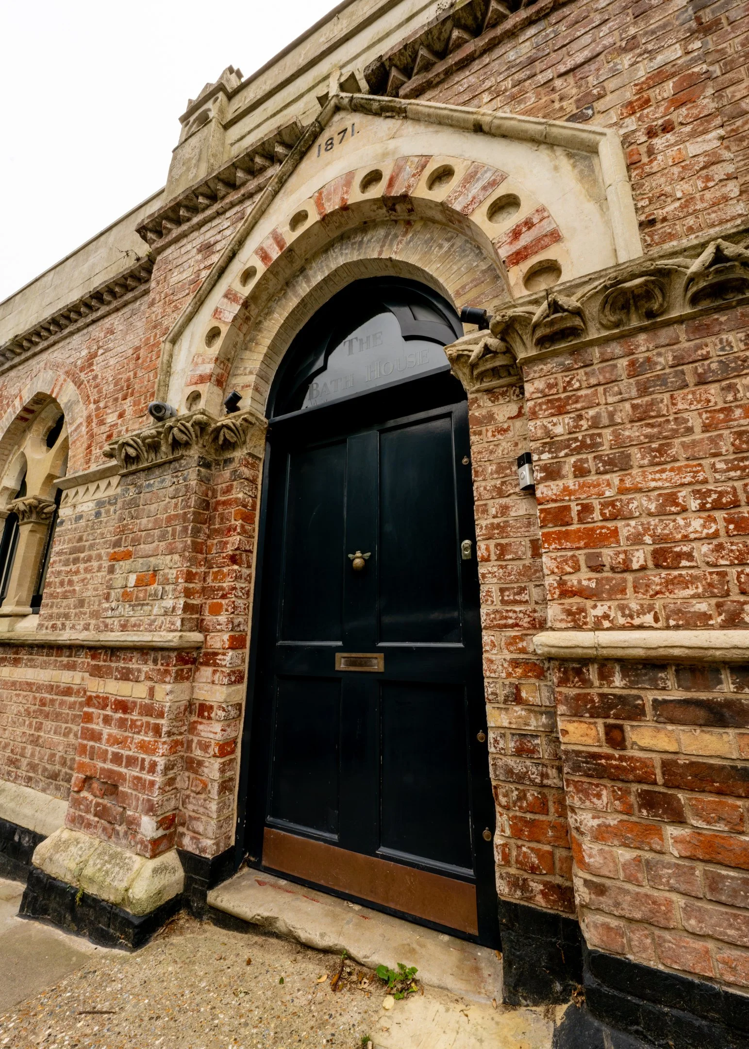 The Bath House 1871 arched entrance viewed straight on